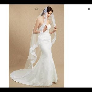 Graceful laced edges veil in white or ivory